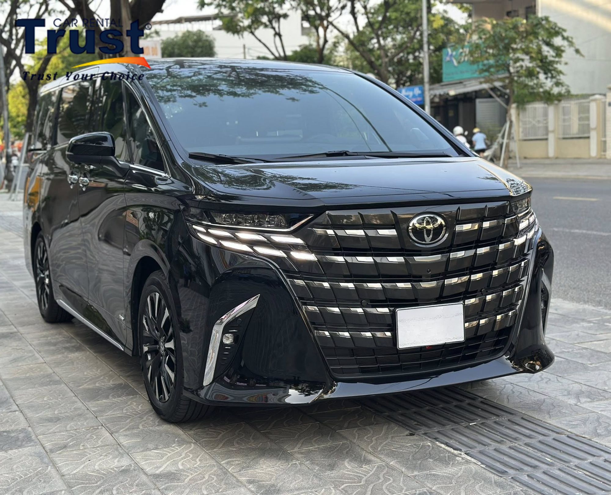 Black Toyota Alphard luxury minivan rental for intercity travel from Ho Chi Minh City