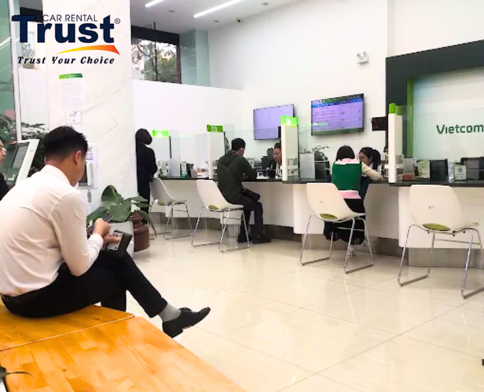 Customers waiting for secure currency exchange in Hanoi at a modern Vietcombank transaction branch