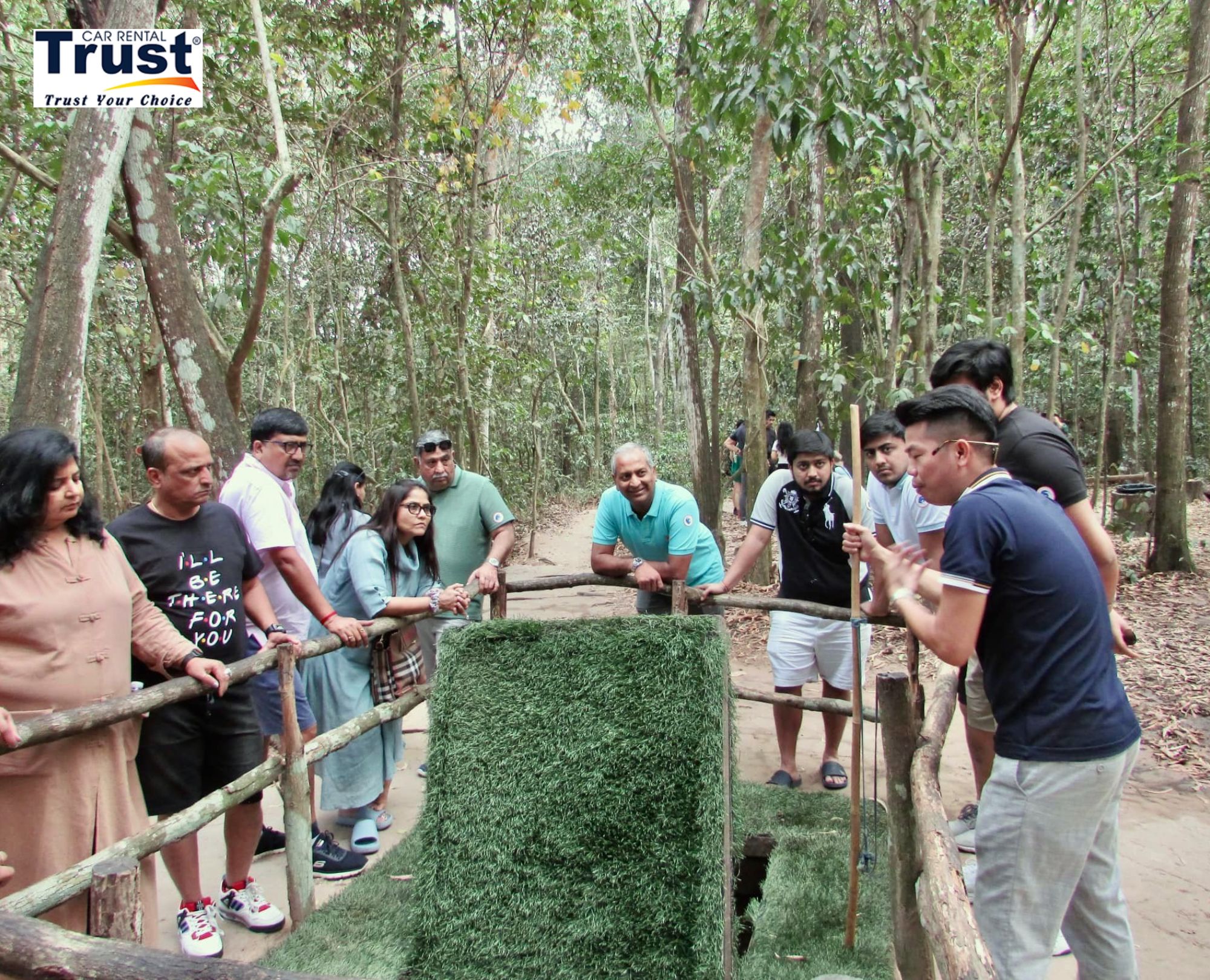guide-explaining-the-mechanics-of-a-historical-trap-to-a-group-of-tourists-at-the-cu-chi-tunnels
