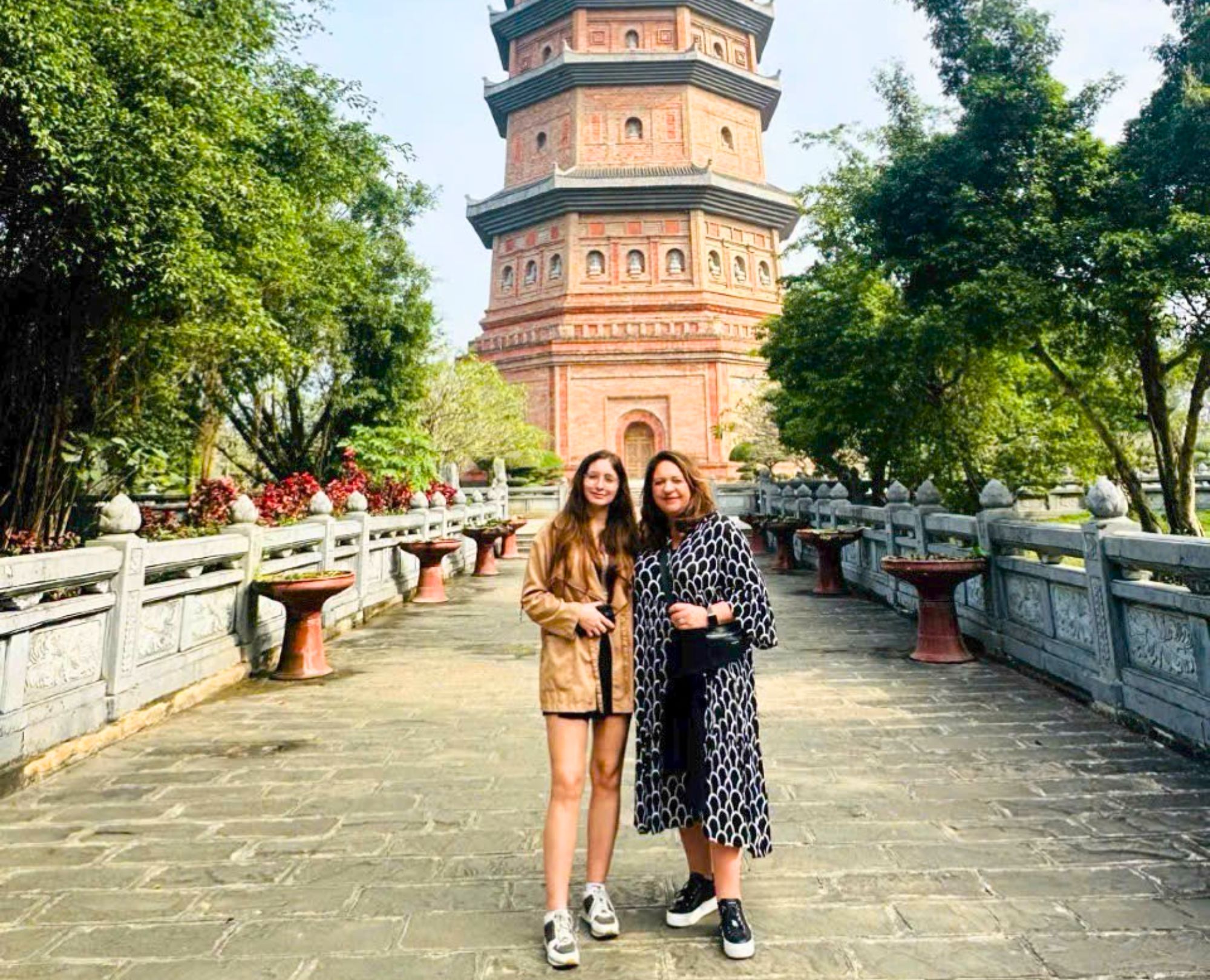 International tourists visiting the majestic Bai Dinh Pagoda stupa in Ninh Binh