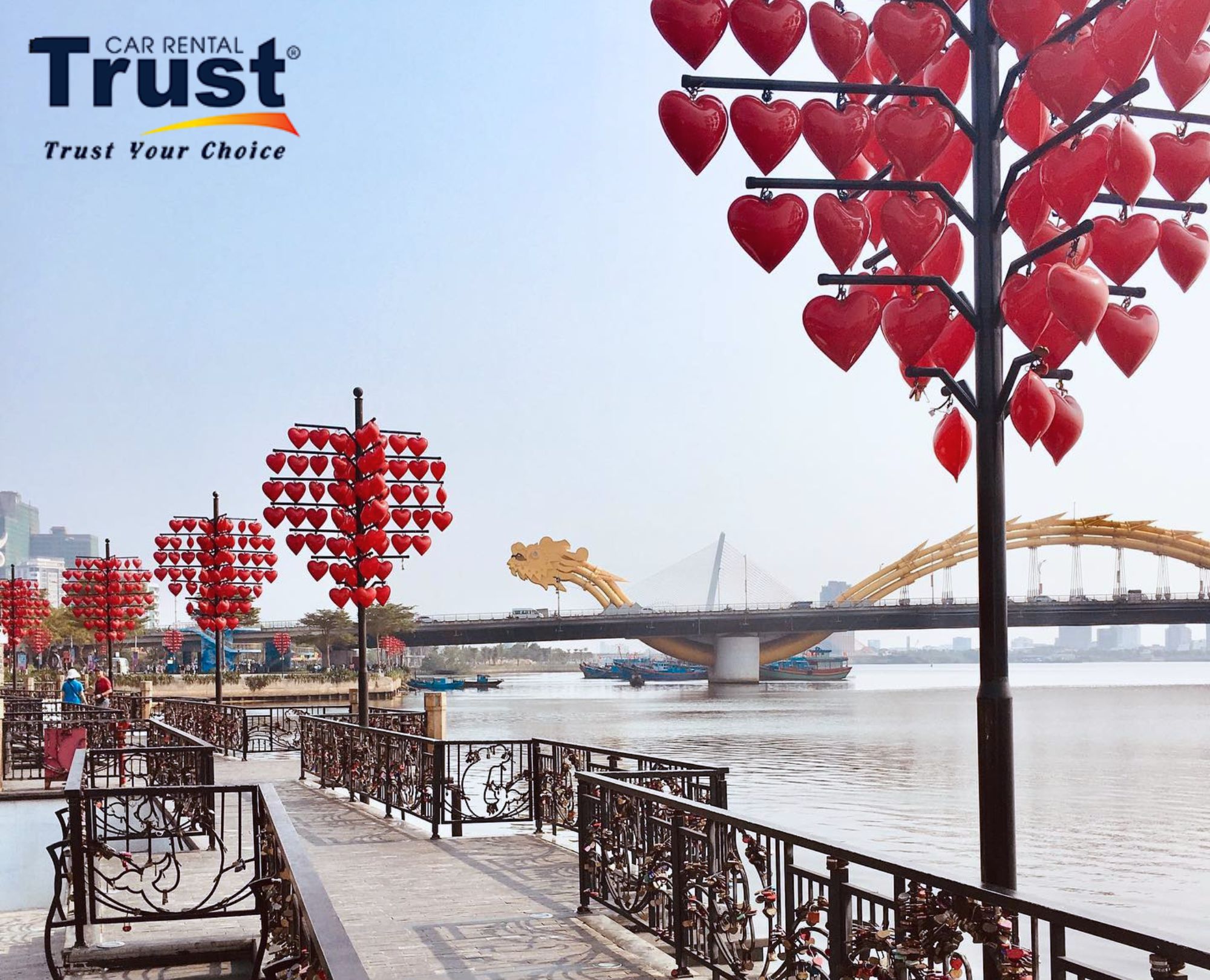 love-lock-bridge-in-danang-featuring-heart-shaped-lanterns-and-a-view-of-the-dragon-bridge-across-the-han-river