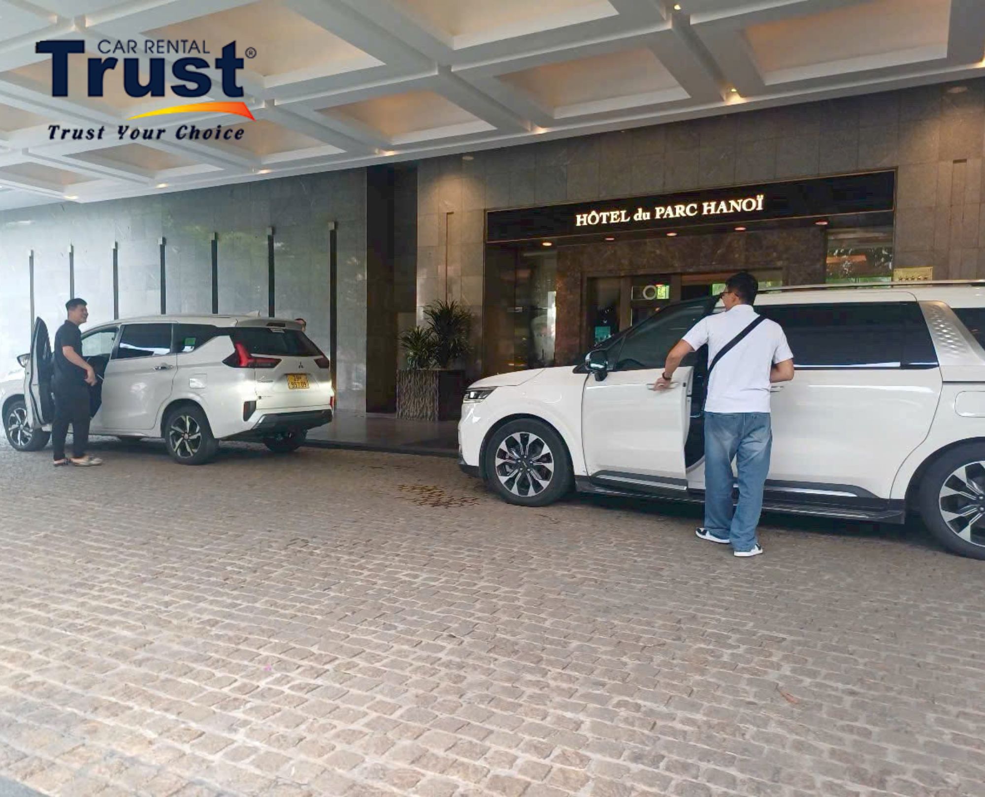 Professional driver waiting for passengers during hotel pickup in Hanoi center