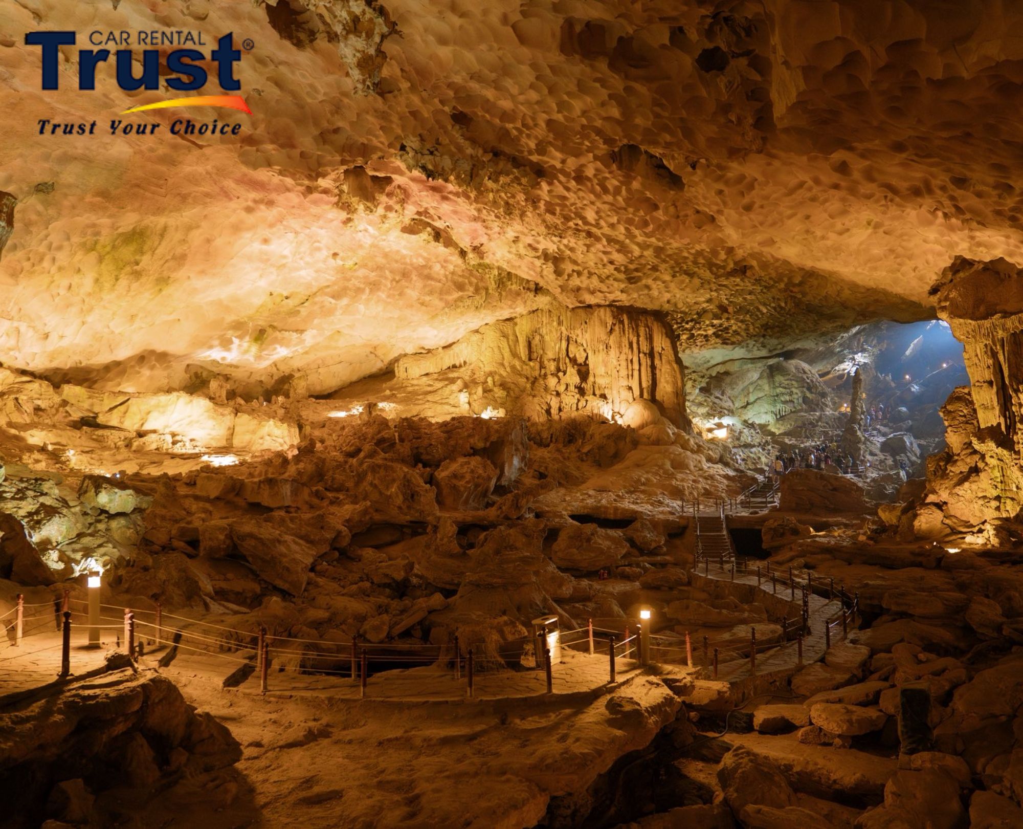 Stunning interior of Surprise Cave on a Halong Bay 1 day cruise, showing beautiful rock formations and tour lighting