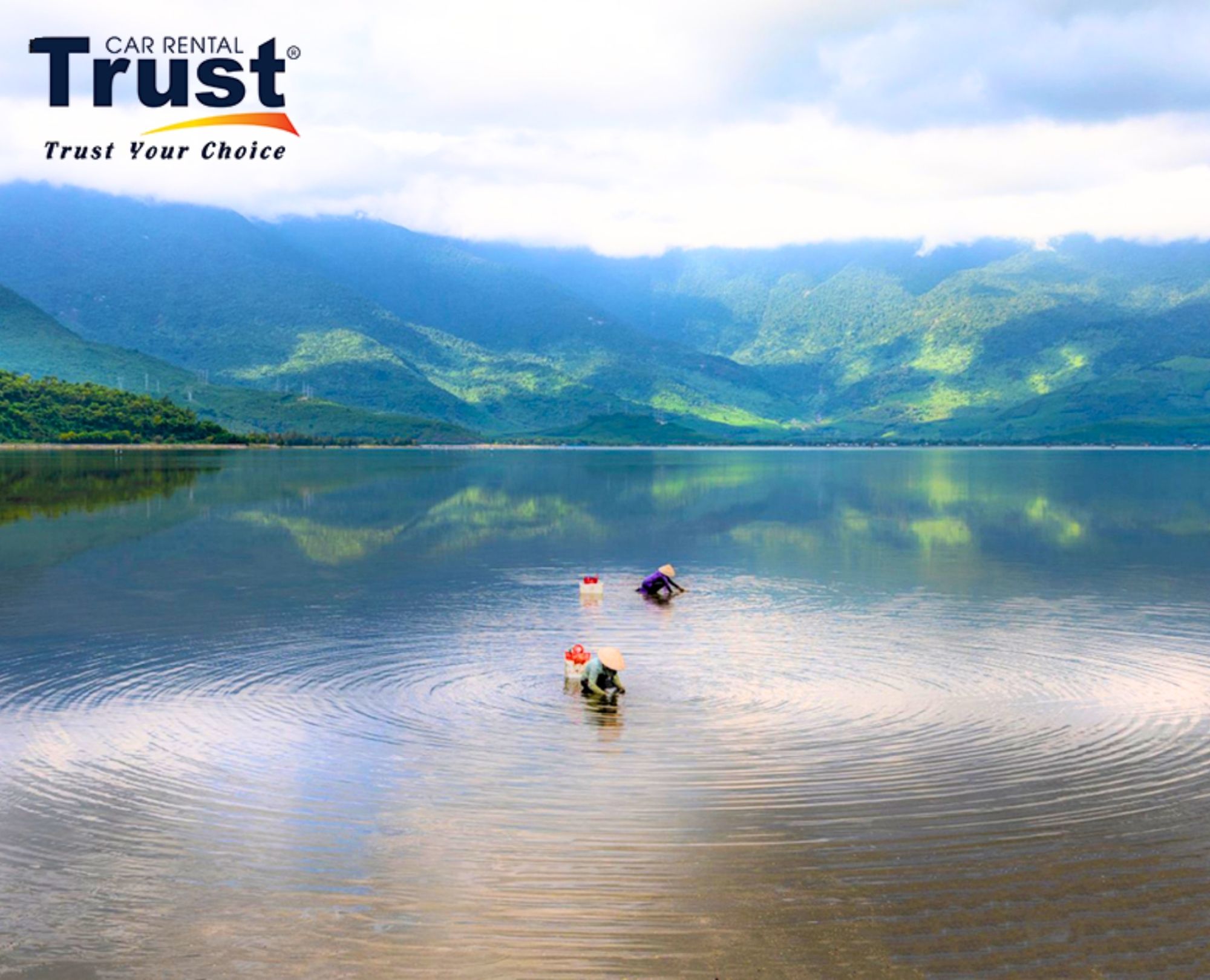 stunning-landscape-photo-of-lap-an-lagoon-with-clear-water-dramatic-mountain-backdrop-and-rippling-water-circles