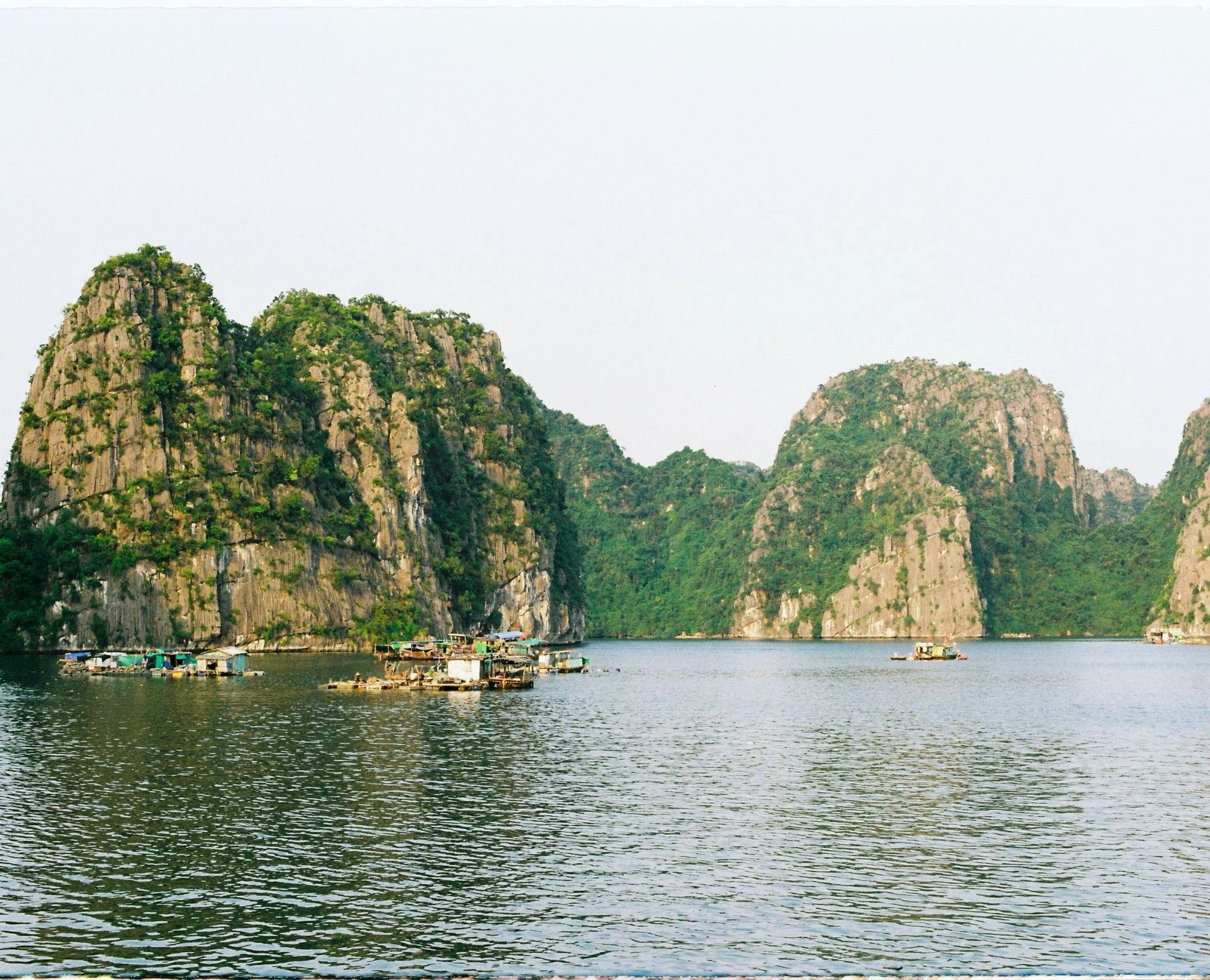 Stunning limestone karsts and floating fishing villages in Halong Bay, a UNESCO World Heritage site in Vietnam