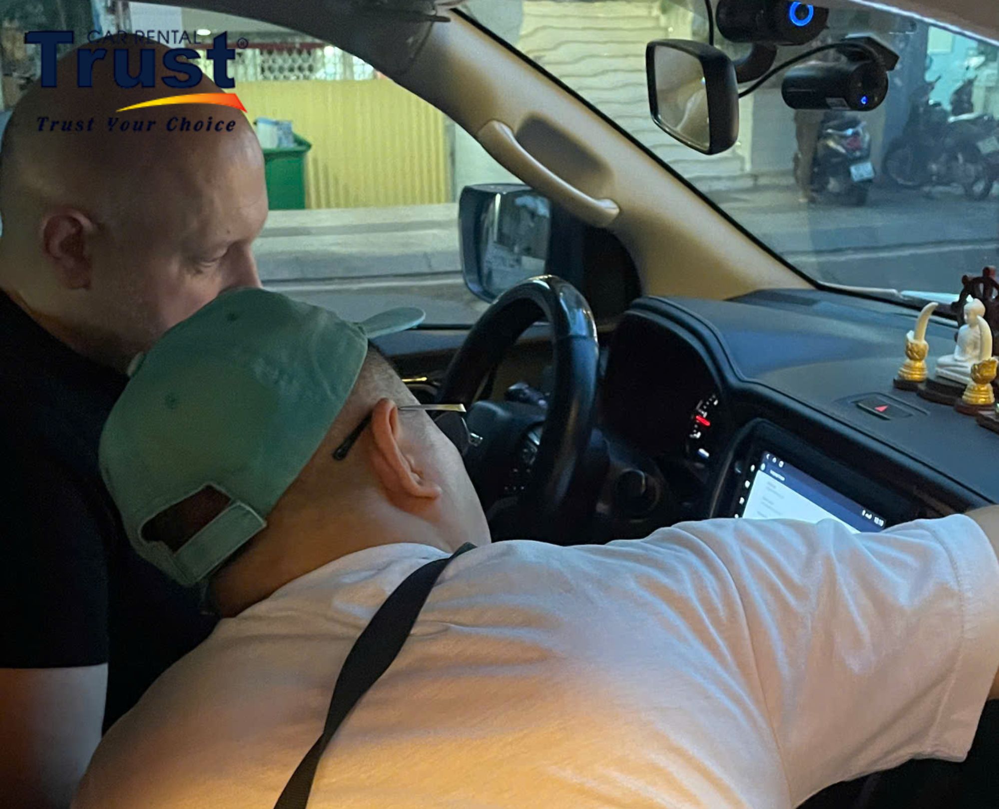 The driver instructs and hands over the vehicle to the self-drive car rental customer