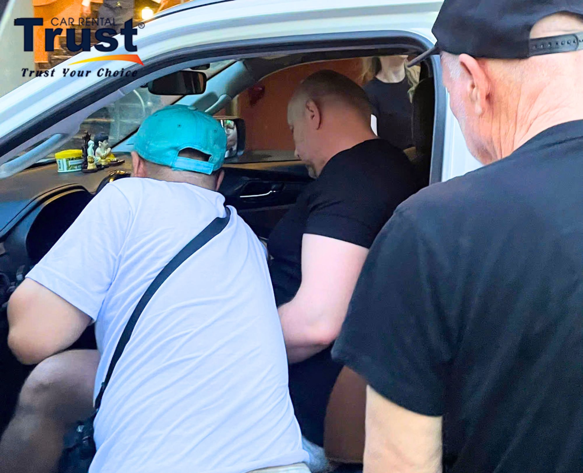 The driver is instructing the passenger on how to use the vehicle and on traffic laws in Vietnam