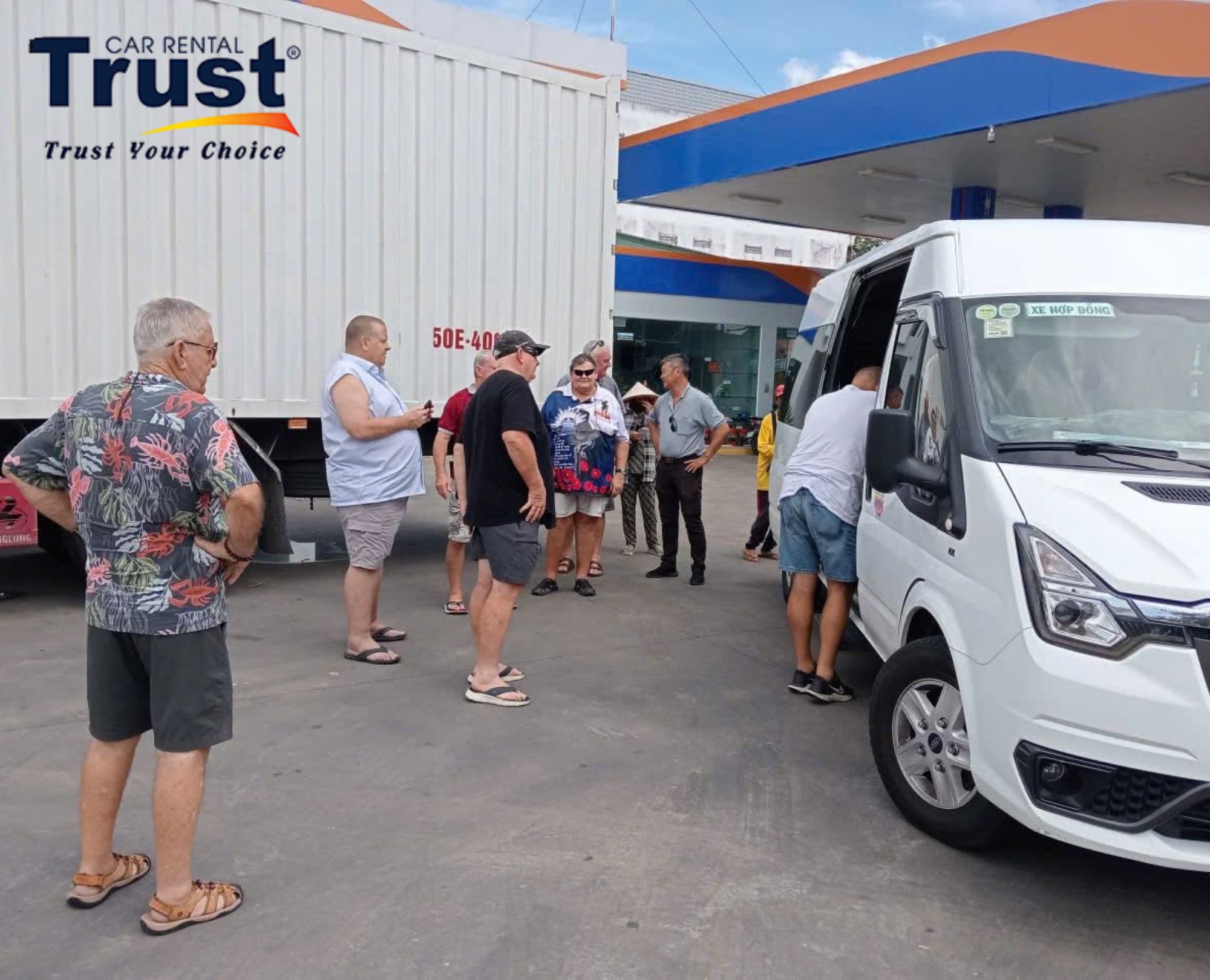 The group is greeting the driver at before the trip start