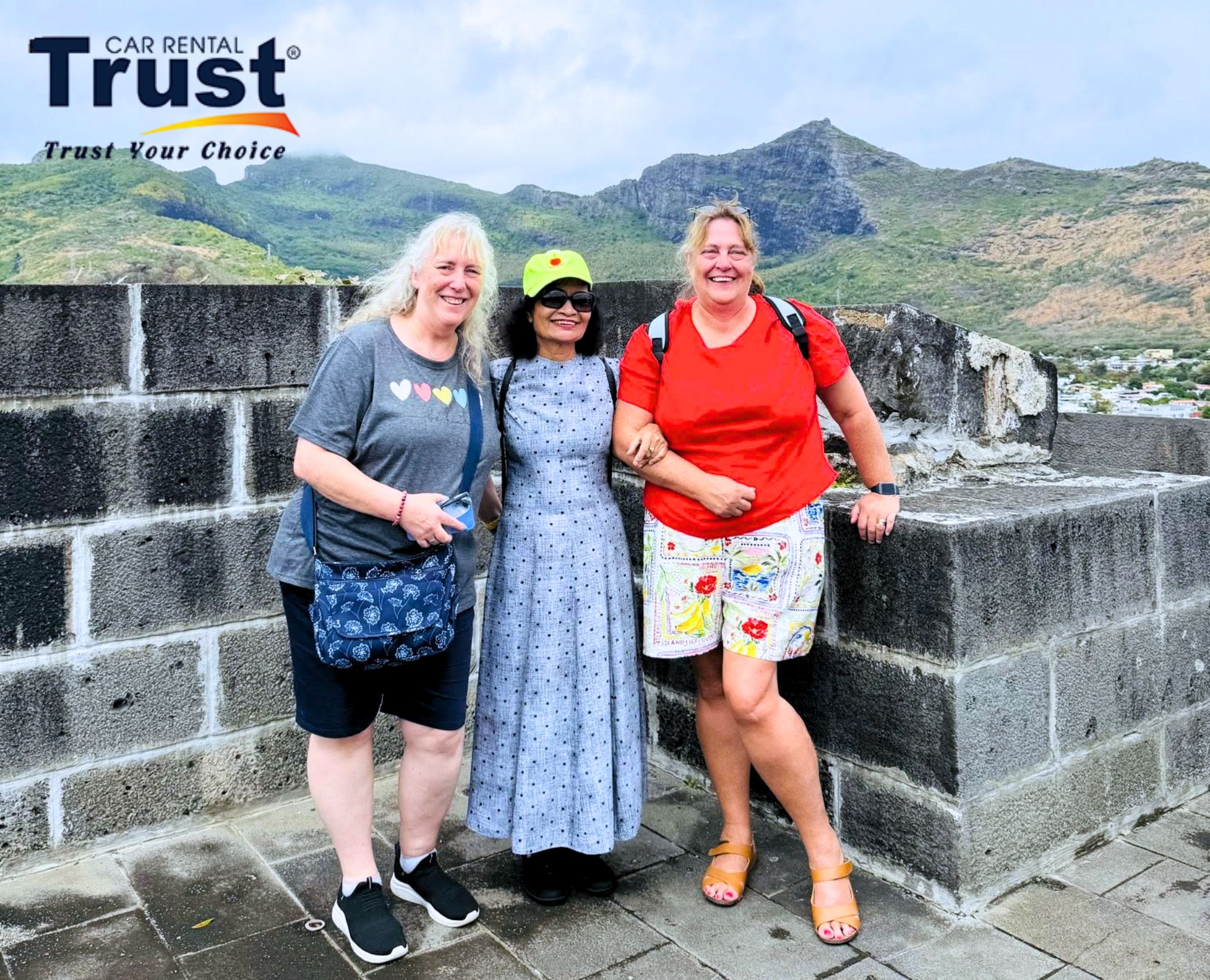 three-women-enjoying-the-panoramic-views-from-a-historical-site-on-hai-van-pass-during-a-private-car-tour