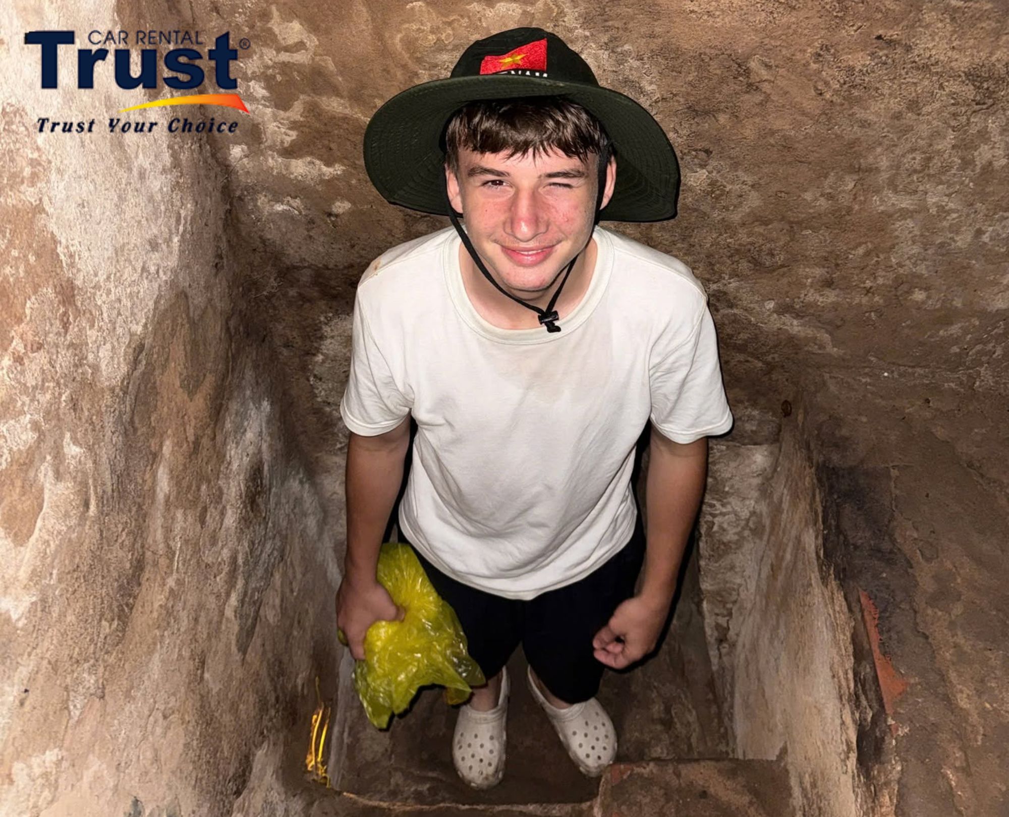 Tourist exploring the Cu Chi Tunnels on a half-day plan