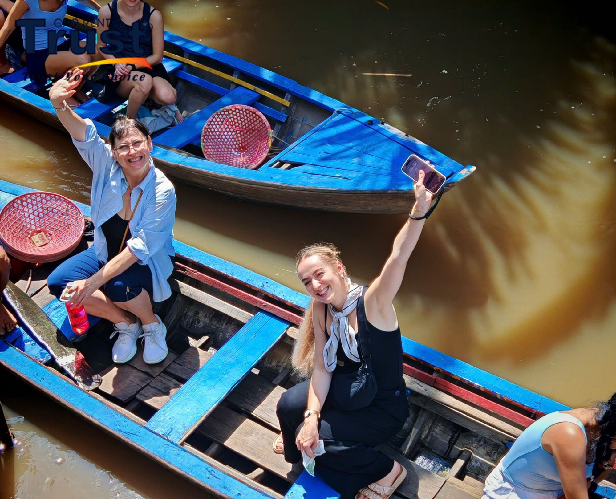 Tourists on a wooden boat on Mekong Delta 2 Days Tour