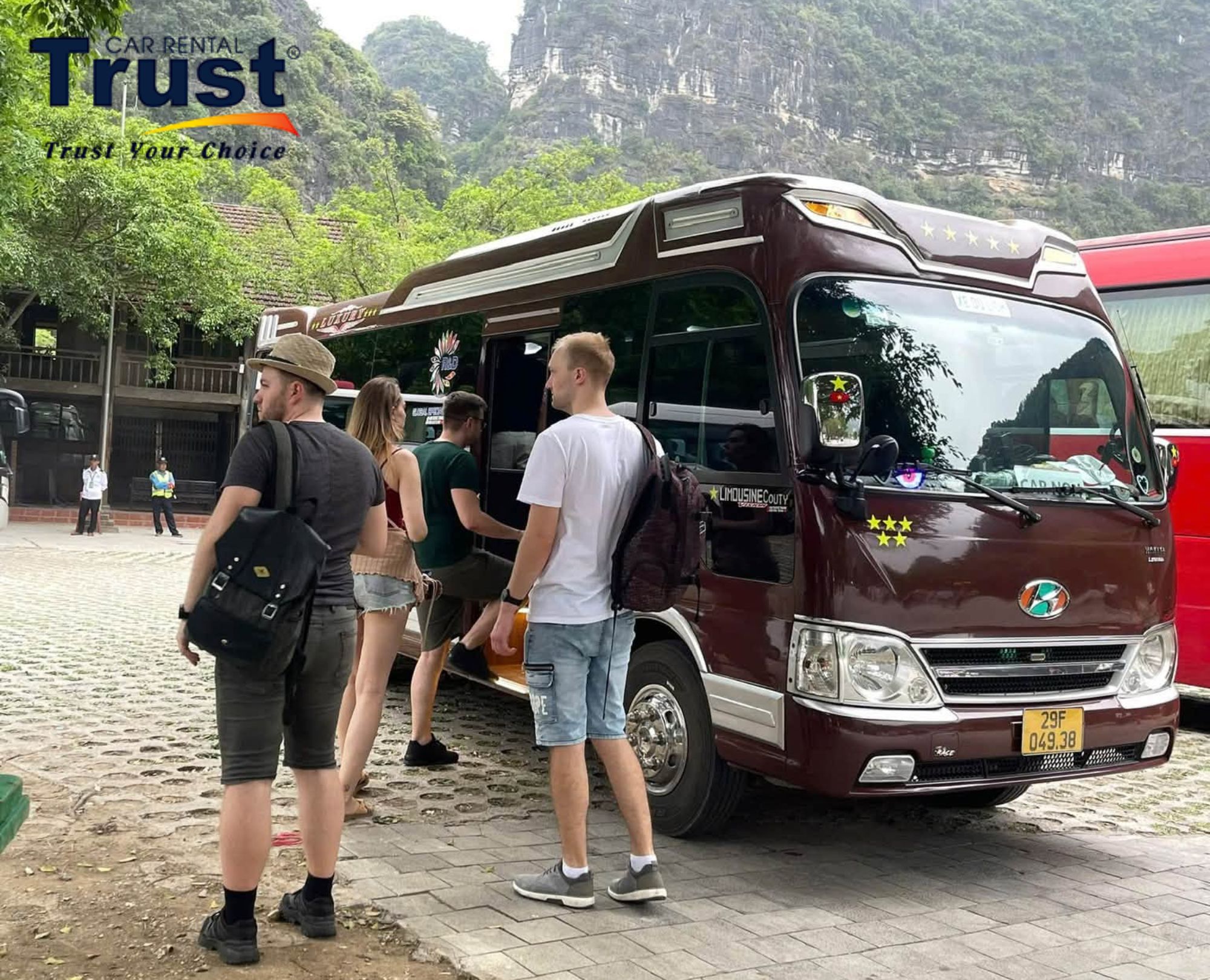 Travelers getting into a tourist bus for their return journey from Tam Dao back to Hanoi